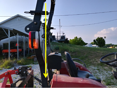 You will want to place the mount on the right-hand side of the tractor. The bucket controls are on this side and you enter and exit the seat on the left side.
